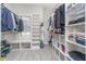 Walk-in closet with custom shelving, ample storage, and a window providing natural light at 519 Southwind, Brownsburg, IN 46112
