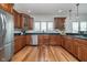 Spacious kitchen with stainless steel appliances and wood cabinetry at 519 Southwind, Brownsburg, IN 46112