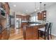 Well-equipped kitchen with granite countertops, stainless appliances, and breakfast bar at 519 Southwind, Brownsburg, IN 46112