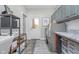 Well-organized laundry room with washer, dryer, storage cabinets, shelving, and access to the exterior at 519 Southwind, Brownsburg, IN 46112