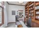 Office with built-in shelving, desk, and view of dining room, creating a functional workspace at 519 Southwind, Brownsburg, IN 46112