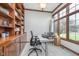 Bright office with built-in bookshelves, large window offering natural light, and neutral carpet at 519 Southwind, Brownsburg, IN 46112