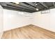Unfinished basement with open ceiling, painted walls, and durable floors, offering potential for customization at 5849 Brouse Ave, Indianapolis, IN 46220