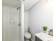 Bathroom featuring a shower stall, modern toilet, and sleek vanity with contemporary faucet at 5849 Brouse Ave, Indianapolis, IN 46220