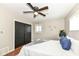 Light bedroom with a bed, closet, and wooden floor at 5849 Brouse Ave, Indianapolis, IN 46220