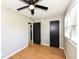 A bright bedroom with hardwood floors and a ceiling fan for added comfort at 5849 Brouse Ave, Indianapolis, IN 46220