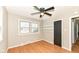 Clean bedroom with ceiling fan and open closet storage at 5849 Brouse Ave, Indianapolis, IN 46220