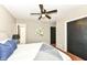 Inviting bedroom featuring bed, bathroom view and closet at 5849 Brouse Ave, Indianapolis, IN 46220