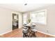 Charming dining area features a table for four and a view of the backyard at 5849 Brouse Ave, Indianapolis, IN 46220