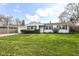 Charming single-story home with well-manicured lawn, inviting curb appeal, and attached garage at 5849 Brouse Ave, Indianapolis, IN 46220
