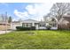 Charming single-story home with well-manicured lawn, inviting curb appeal, and attached garage at 5849 Brouse Ave, Indianapolis, IN 46220