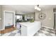Open-concept kitchen connected to living area features a modern design with stainless appliances at 5849 Brouse Ave, Indianapolis, IN 46220