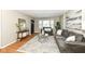 Comfortable living room featuring stylish gray sofas, decorative rug, and ample natural light at 5849 Brouse Ave, Indianapolis, IN 46220