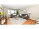 Comfortable living room featuring stylish gray sofas, decorative rug, and ample natural light at 5849 Brouse Ave, Indianapolis, IN 46220