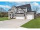 Charming two-story home with three car garage and a large concrete driveway at 6027 Brentwood Trce, Brownsburg, IN 46112