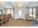 Bright foyer featuring a chandelier, wood floors, and a decorative sitting area at 6027 Brentwood Trce, Brownsburg, IN 46112