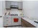 Small kitchen with gray cabinets and a marble backsplash at 6027 Brentwood Trce, Brownsburg, IN 46112