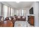 Living room and dining area with natural light and a leather sofa at 6027 Brentwood Trce, Brownsburg, IN 46112