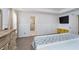 Spacious bedroom featuring stylish trim, large windows with decorative curtains, and access to a private bathroom at 6027 Brentwood Trce, Brownsburg, IN 46112