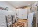 Functional storage room with wood floors, white storage cabinets, and neatly arranged belongings at 6027 Brentwood Trce, Brownsburg, IN 46112