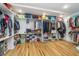 Spacious walk-in closet with custom shelves and rods, offering ample storage for clothing and accessories at 6027 Brentwood Trce, Brownsburg, IN 46112