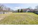 The spacious backyard features a well-manicured lawn and a wooden fence at 6036 Maple Forge Cir, Indianapolis, IN 46254