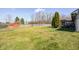 Expansive backyard featuring a green lawn, a shed, and a privacy fence at 6036 Maple Forge Cir, Indianapolis, IN 46254