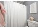Bathroom features a shower with white shower curtain and decor at 6036 Maple Forge Cir, Indianapolis, IN 46254