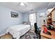 Bedroom featuring a desk, single bed, ceiling fan, and window for natural light at 6036 Maple Forge Cir, Indianapolis, IN 46254