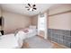 Cozy bedroom with storage, plush rug, and a window letting in natural light at 6036 Maple Forge Cir, Indianapolis, IN 46254