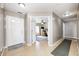Bright foyer with hardwood floors and entry to office and other rooms at 6036 Maple Forge Cir, Indianapolis, IN 46254