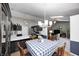 Open concept eat-in kitchen with modern appliances and spacious breakfast bar overlooking the cozy living room at 6036 Maple Forge Cir, Indianapolis, IN 46254