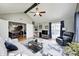 Spacious living room with vaulted ceiling, hardwood floors and French doors leading to the kitchen at 6036 Maple Forge Cir, Indianapolis, IN 46254