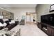 Comfortable living room with plush seating, entertainment center, and inviting ambiance at 6036 Maple Forge Cir, Indianapolis, IN 46254
