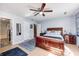 Comfortable primary bedroom suite with a ceiling fan and ensuite bathroom at 6036 Maple Forge Cir, Indianapolis, IN 46254