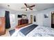 Cozy primary bedroom featuring hardwood floors, ceiling fan, and ensuite bathroom at 6036 Maple Forge Cir, Indianapolis, IN 46254
