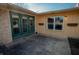 A charming exterior view of the back patio featuring classic double doors, and a cozy outdoor space at 6315 S Keystone Ave, Indianapolis, IN 46227