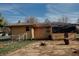 Back of home with a brick section and nice backyard, showing a practical and functional outdoor space at 6315 S Keystone Ave, Indianapolis, IN 46227