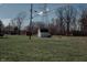 Spacious backyard with several outbuildings and lush greenery, offering ample space for outdoor activities at 6315 S Keystone Ave, Indianapolis, IN 46227