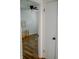 View into bedroom, featuring wood floors and simple decor at 6315 S Keystone Ave, Indianapolis, IN 46227