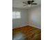 Bedroom with wood floors, a ceiling fan, and a window at 6315 S Keystone Ave, Indianapolis, IN 46227