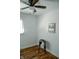 Bright bedroom featuring wood floors, a ceiling fan, and a window with blinds at 6315 S Keystone Ave, Indianapolis, IN 46227