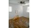 Bedroom with wood floors, a window, a ceiling fan and simple decor at 6315 S Keystone Ave, Indianapolis, IN 46227