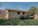 Exterior of home with brick accents and well-maintained lawn, blending curb appeal with outdoor practicality at 6315 S Keystone Ave, Indianapolis, IN 46227