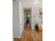 Hallway featuring wood floors, white trim, and contemporary decor elements at 6315 S Keystone Ave, Indianapolis, IN 46227