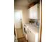 Lovely laundry room with washer, dryer, cabinets and a decorative rug at 6315 S Keystone Ave, Indianapolis, IN 46227