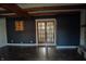 A living room with wood floors, beamed ceilings, and french doors at 6315 S Keystone Ave, Indianapolis, IN 46227