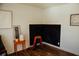 Minimalist room featuring dark fireplace and clean white walls at 6315 S Keystone Ave, Indianapolis, IN 46227