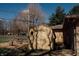 Outdoor shed provides convenient storage space, complemented by mature trees and partial lawn at 6315 S Keystone Ave, Indianapolis, IN 46227