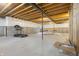 Unfinished basement featuring a treadmill, metal support posts, exposed wood beams, and painted foundation at 6672 Eagles Nest Ln, McCordsville, IN 46055